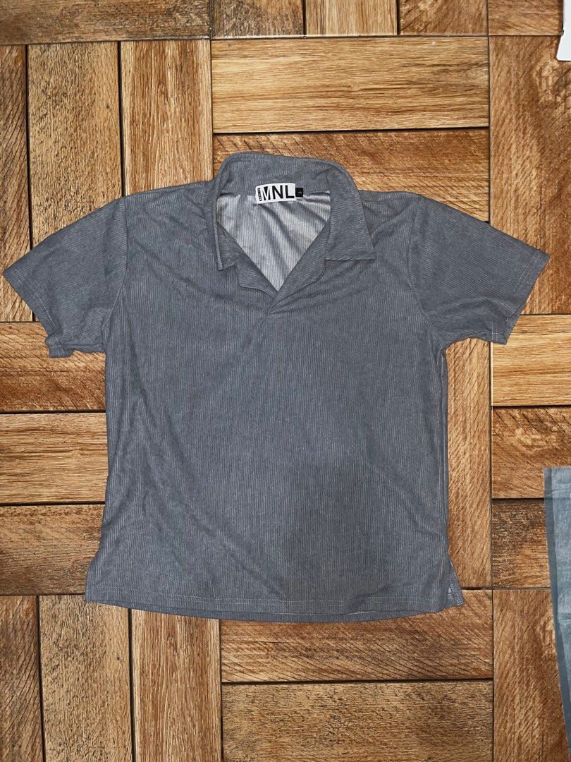 Made in MNL Light Blue Polo Shirt (Category: Tshirts & Polo Shirts ) located in Makati City. Submitted by gabrayco (Listing ID 1436513639, Image 1). Description: - Gray MNL polo shirt - Short sleeves - Collared neckline - Ribbed fabric - Measurements: - Chest: 20 inches - Length: 25 inches - Perfect for casual wear.