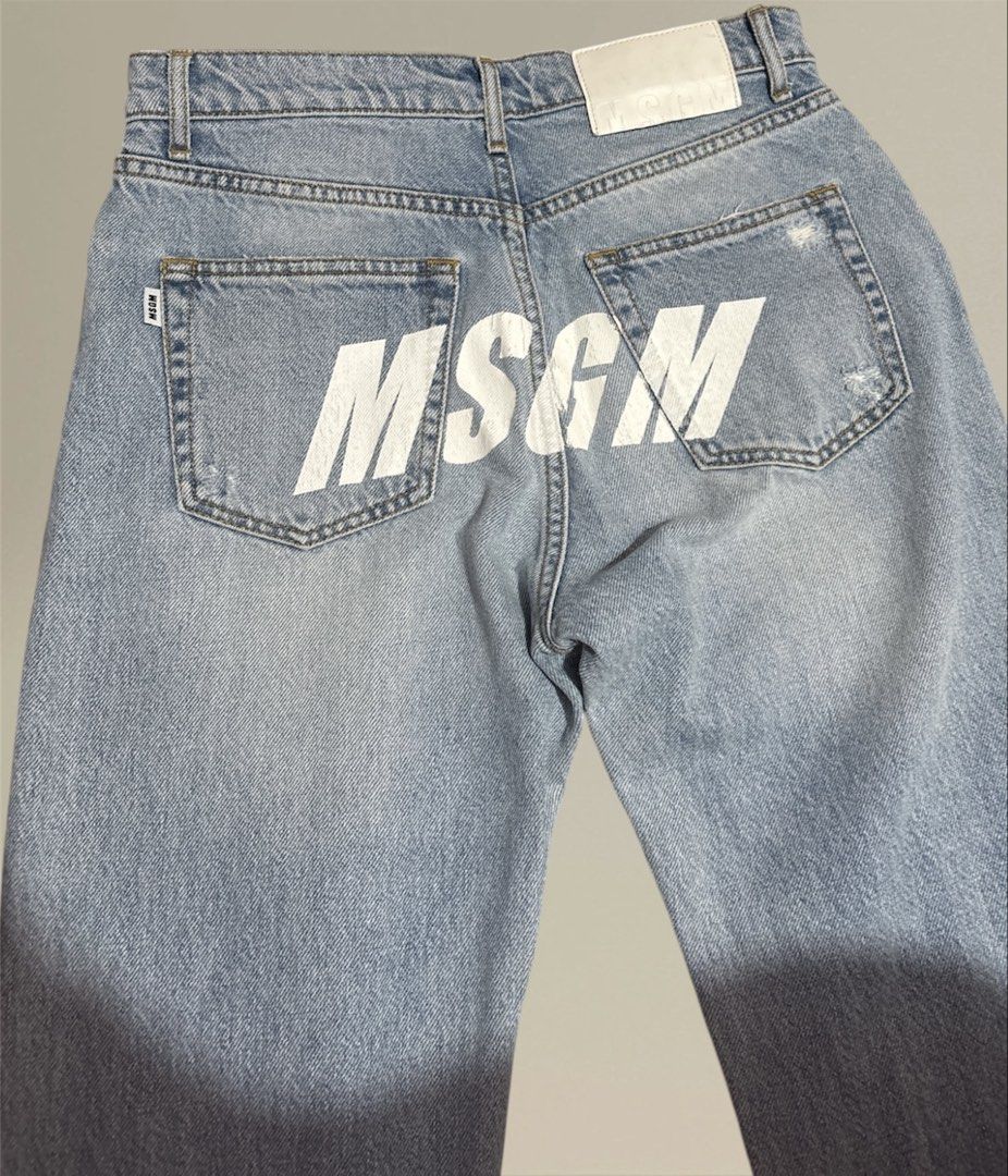 MSGM Denim Jeans (boyfriend jeans) (Category: Jeans) located in Pasig City. Submitted by burtonxxx (Listing ID 1436521889, Image 1). Description: - Light blue denim jeans - MSGM logo printed on the back - Straight leg fit - Distressed details on the front - Button fly closure - 30 waist - 38 hips - 37 length - 7 hem - rise 11.