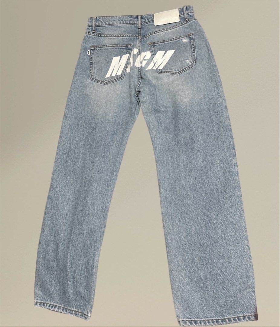 MSGM Denim Jeans (boyfriend jeans) (Category: Jeans) located in Pasig City. Submitted by burtonxxx (Listing ID 1436521889, Image 2). Description: - Light blue denim jeans - MSGM logo printed on the back - Straight leg fit - Distressed details on the front - Button fly closure - 30 waist - 38 hips - 37 length - 7 hem - rise 11.