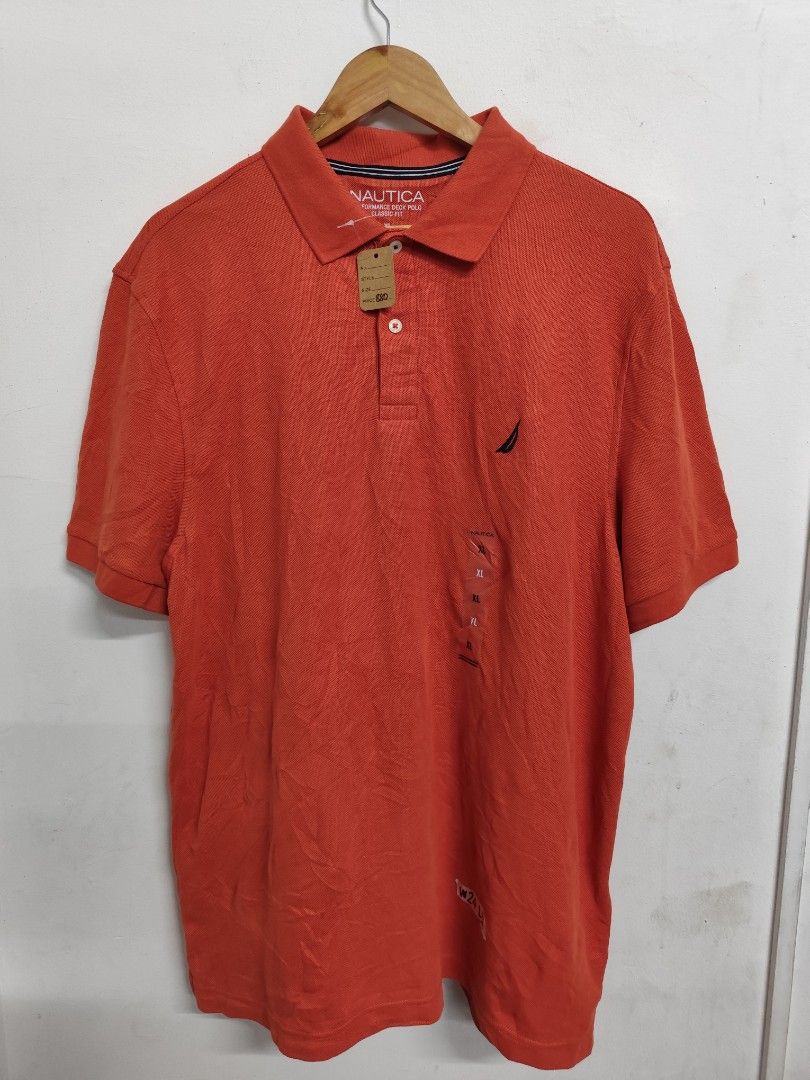Nautica Performance Deck Polo Shirt XL (Category: Tshirts & Polo Shirts ) located in Compostela. Submitted by fashiondeamar (Listing ID 1436611736, Image 2). Description: - Nautica Performance Deck Polo Shirt - Color: Orange - Size: XL - Classic Fit - Made with sustainably crafted materials - Features the Nautica logo on the chest - Includes original tags - Made in Indonesia.