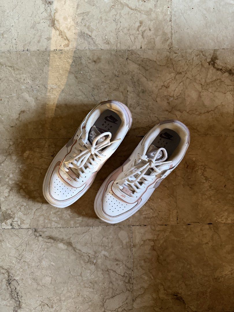 Nike AF1 Shadow White/Amethyst Oxford (Category: Sneakers) located in Pasig City. Submitted by declutterwithe (Listing ID 1436542144, Image 2). Description: - Nike W AF1 Shadow - Color: White and Pink - Size: US 7 women’s - Layered design - Includes original box.