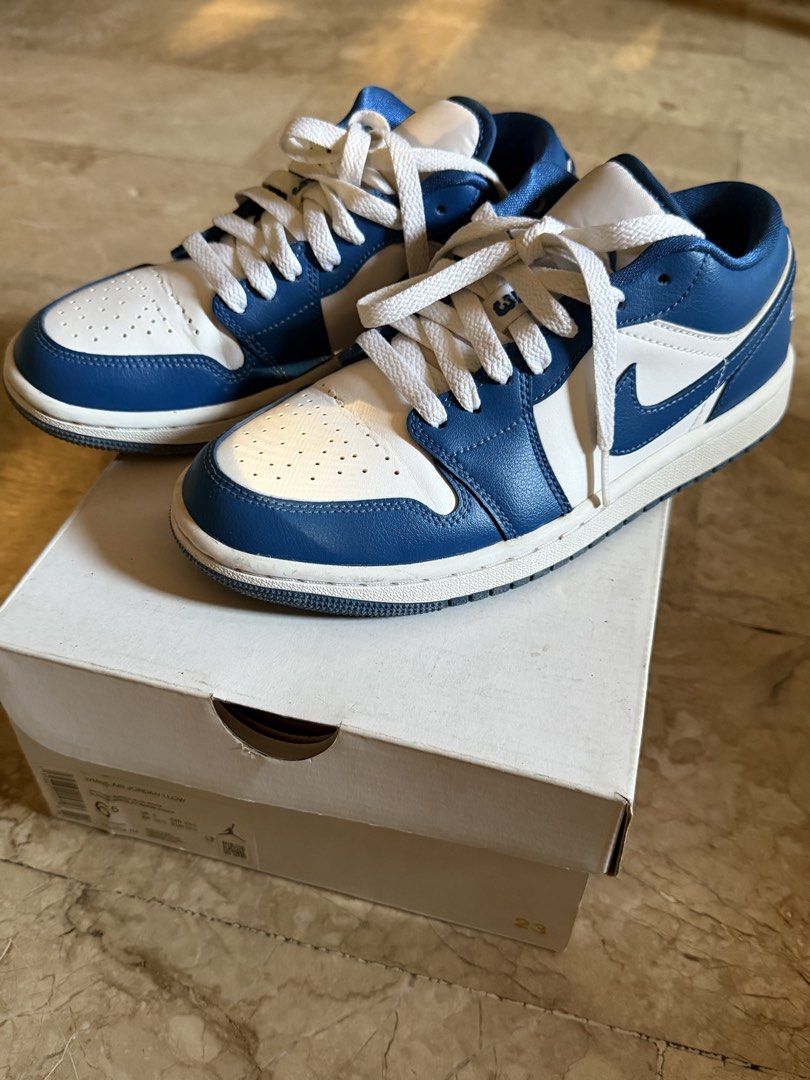 Nike Air Jordan 1 Low - White/Blue (Category: Sneakers) located in Pasig City. Submitted by declutterwithe (Listing ID 1436541937, Image 1). Description: - Air Jordan 1 Low - Color: White and Blue - Size: 6.5 (Women's) - Includes original box - Style code: DQ7774 114.
