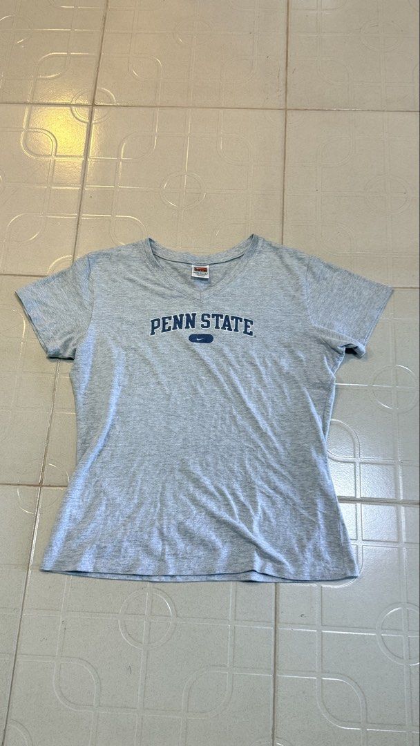 Nike Penn State Gray T-shirt (Category: Tshirts & Polo Shirts ) located in Manila. Submitted by alegnaacir (Listing ID 1436649995, Image 1). Description: - Gray Nike Penn State T-shirt - Size: L (12-14) - Made in Mexico - Material: 90% cotton, 10% polyester - Features: Short sleeves, crew neck.