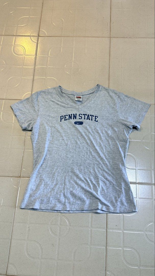 Nike Penn State Gray T-shirt (Category: Tshirts & Polo Shirts ) located in Manila. Submitted by alegnaacir (Listing ID 1436649995, Image 2). Description: - Gray Nike Penn State T-shirt - Size: L (12-14) - Made in Mexico - Material: 90% cotton, 10% polyester - Features: Short sleeves, crew neck.