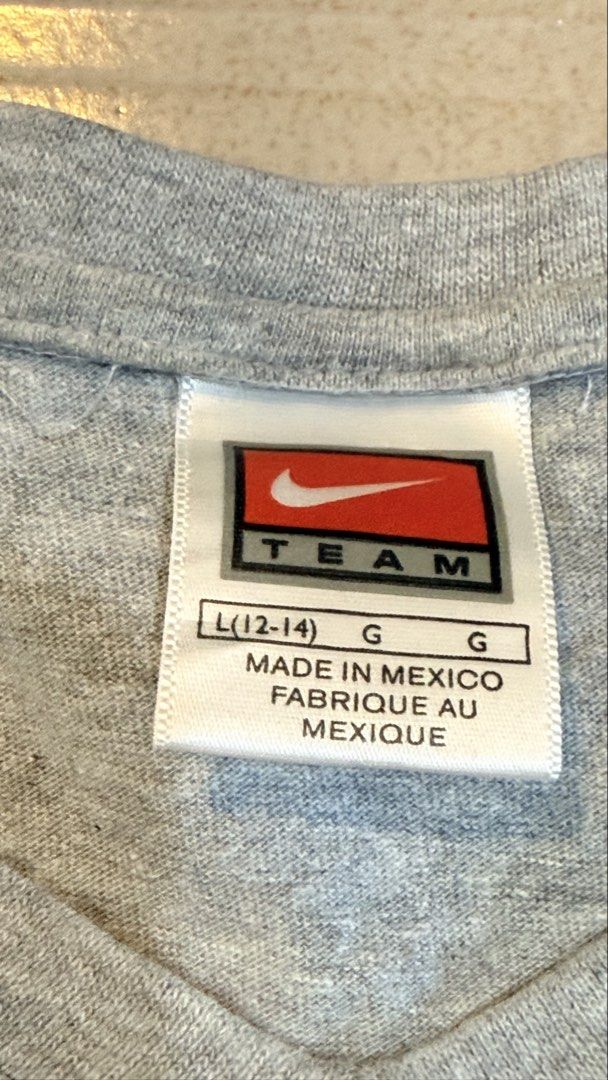 Nike Penn State Gray T-shirt (Category: Tshirts & Polo Shirts ) located in Manila. Submitted by alegnaacir (Listing ID 1436649995, Image 3). Description: - Gray Nike Penn State T-shirt - Size: L (12-14) - Made in Mexico - Material: 90% cotton, 10% polyester - Features: Short sleeves, crew neck.