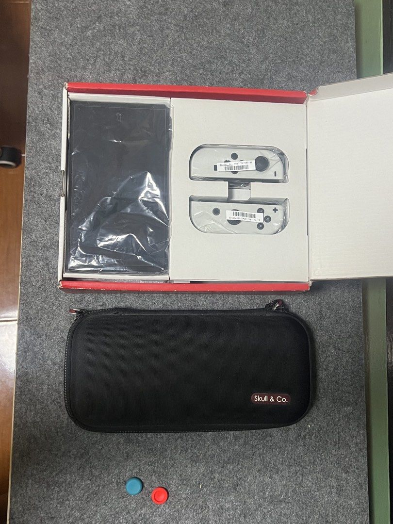 NINTENDO SWITCH OLED (64GB) 128 SD (Category: Nintendo) located in Manila. Submitted by itsmemark26 (Listing ID 1436574537, Image 3). Description: NINTENDO SWITCH OLED 64GB 128SD COMPLETE BOX MANUAL CHARGER HDMI CABLE DOCK JOYCON JOYCON ADAPTER SKULL & CO POUCH + 1 game BAYONETTA 3 GOOD AS NEW 13500.