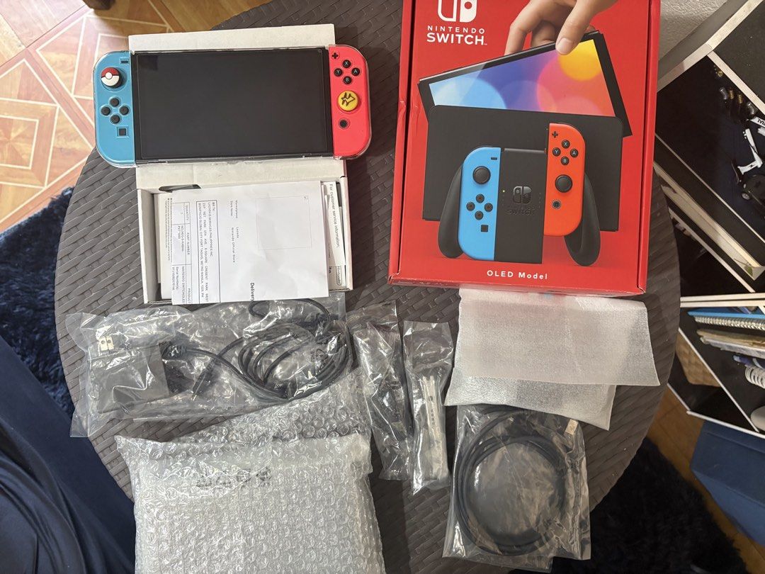 Nintendo Switch OLED Model (Category: Nintendo) located in Pasig City. Submitted by sidjiggeralmazan (Listing ID 1436549069, Image 1). Description: For Sale: Nintendo Switch OLED (Neon Blue / Red) Price: 10K *with Receipt and 2 Years Warranty Bought last November 2026 from Nintendo Official Store Complete with Box and all Accessories Freebie: Installed with Tempered Glass, Clear Case, and Joystick Cover RFS: Only used to play Legends Z-A.