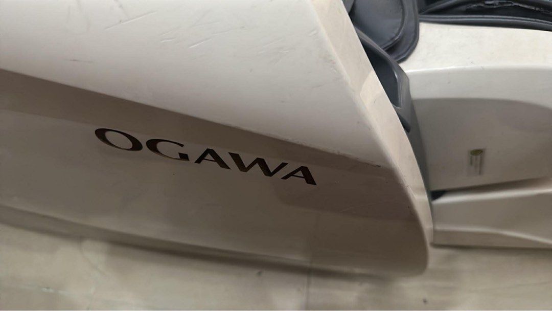 Ogawa Smart ReLuxe Massage Chair (Category: Massage Devices) located in Makati City. Submitted by kristine_p_a (Listing ID 1431472199, Image 1). Description: - Ogawa Smart Relux massage chair - Orig price: ₱140k, with receipt - Sleek black and white design - Includes remote control for easy operation - Offers various massage functions - Features foot massage capabilities - Designed for relaxation and comfort - Quilted seat design.