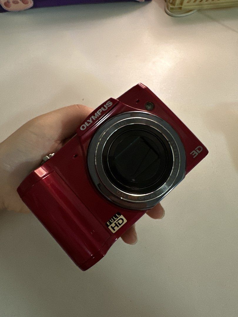 Olympus SZ-20 Digital Camera (Category: Cameras) located in Quezon City. Submitted by mailsbyme (Listing ID 1436618910, Image 2). Description: - Olympus SZ-20 digital camera (red) - all functions working - w/ pop-up flash - 12.5x super wide zoom - 16 megapixels - Full HD display BODY: 10/10 INCLUSIONS: - unit - camera case - two batteries - charger NO RETURN & REFUND POLICY! DO YOUR RESEARCH BEFORE BUYING. CAN DO SAME DAY DELIVERY FREEBIES: - sti