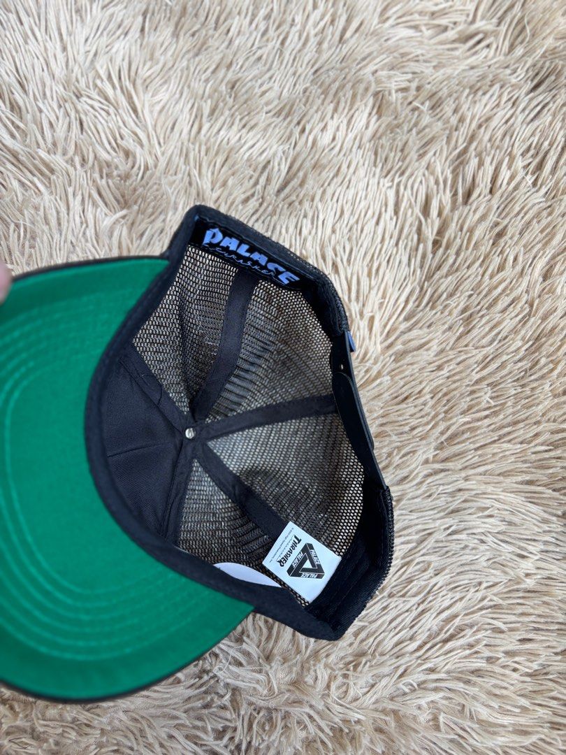 Palace Thrasher Cap (Category: Caps & Hats) located in Quezon City. Submitted by nojthrift (Listing ID 1436509458, Image 3). Description: - Black Palace x Thrasher cap - Mesh back for breathability - Green underside on the brim - Adjustable strap for a comfortable fit - Embroidered Palace and Thrasher logos - Logos in yellow and orange 850+ship only.