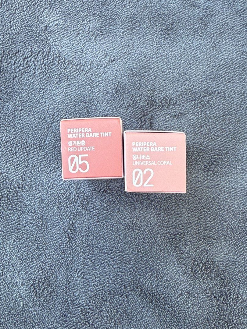 Peripera Water Bare Tint (Category: Makeup) located in Manila. Submitted by ellis99 (Listing ID 1436631487, Image 2). Description: Two Peripera Water Bare Tints are available. One is in shade 05 Red Update, and the other is in shade 02 Universal Coral. These tints have a non-drying moisturizing texture that applies easily and leaves fresh colors. Each tint is 3.2g / 0.11oz. 100% authentic Brand new .