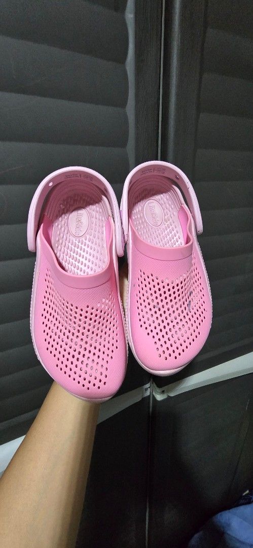 Pink Sandals (Category: Flats & Sandals) located in Manila. Submitted by muliph (Listing ID 1436477599, Image 1). Description: - Size J1 - Pink sandals - Perforated design for breathability - Secure fit with back strap - White sole - Lightweight material - Perfect for casual wear - Soles show some wear - Flaw: minimal pen mark on left pair.