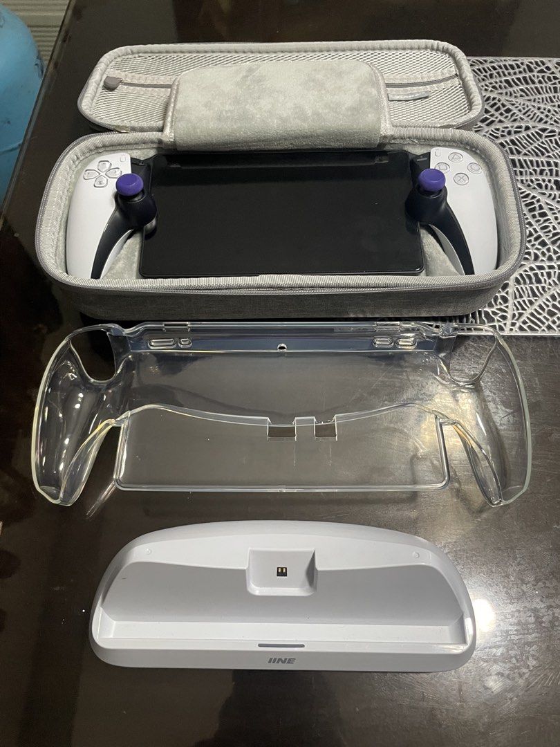 playstation portal with accesories (Category: Controllers) located in Manila. Submitted by juszt (Listing ID 1436555514, Image 2). Description: For sale ps portal Di nagagamit, in good condition, good as new, presentable Inclusion: DOBE pouch (new worth 500) Jelly case Tempered glass (already installed) IINE charging dock (new worth 1k) Type c cable Nego for sure buyer .