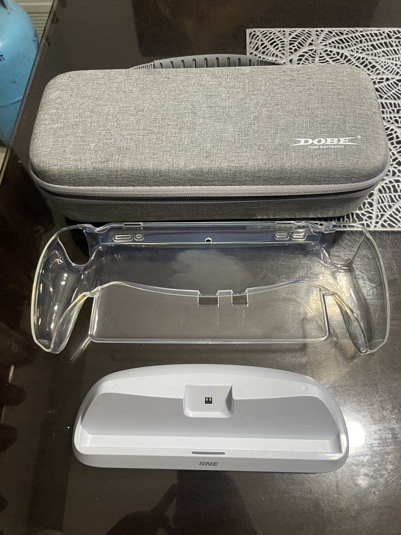 playstation portal with accesories (Category: Controllers) located in Manila. Submitted by juszt (Listing ID 1436555514, Image 3). Description: For sale ps portal Di nagagamit, in good condition, good as new, presentable Inclusion: DOBE pouch (new worth 500) Jelly case Tempered glass (already installed) IINE charging dock (new worth 1k) Type c cable Nego for sure buyer .