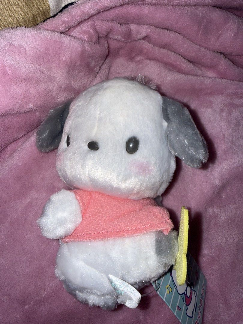 Pochacco Plush Toy (Category: Plushies & Soft Toys) located in Bulacan. Submitted by xxmeiji (Listing ID 1436560958, Image 1). Description: - Adorable Pochacco plush toy - Features a white body and gray ears - Comes with a cute pink shirt - Includes original tag - Perfect for Sanrio fans and collectors - A charming addition to any plush collection.
