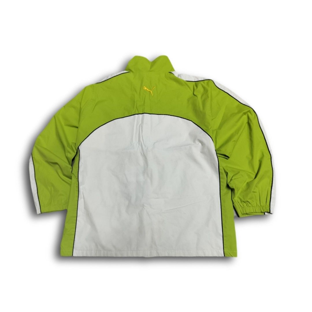 Puma Italy Track Jacket (Category: Coats, Jackets and Outerwear) located in Manila. Submitted by markjunks00 (Listing ID 1436467657, Image 2). Description: - Puma track jacket - Green and white color scheme - Italian flag detail on chest - Full zip closure - Stand-up collar - White accents on sleeves and shoulders - Lightweight design - Suitable for sports and casual wear.