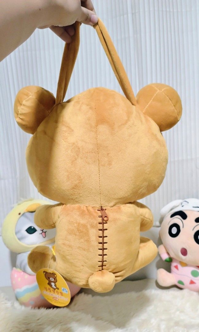 RILAKKUMA 2-IN-1 (PLUSH TOY/BAG) (Category: Plushies & Soft Toys) located in Manila. Submitted by yourfavoritethings7 (Listing ID 1436628748, Image 3). Description: Stuff toy/Bag With small bag compartment and handle. Height: 13 inches.