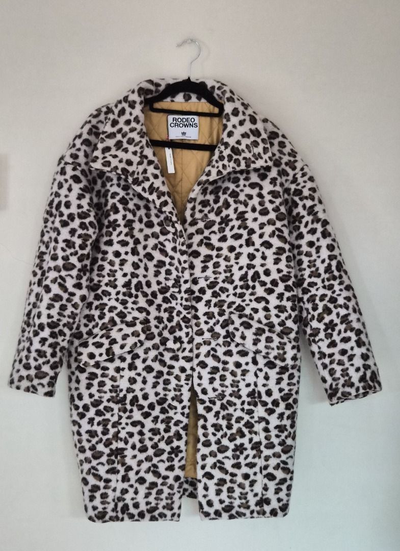Rodeo Crowns Leopard Print Coat (Category: Coats, Jackets and Outerwear) located in Makati City. Submitted by shaundeshop (Listing ID 1436573138, Image 1). Description: - Leopard print coat - Classic collar - Button-down closure - Two front pockets - Quilted lining - Authentic brand.
