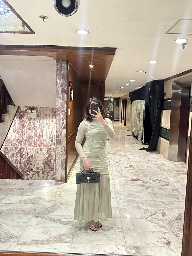 Sage Green Ruched Maxi Dress (Category: Dresses) located in Pasig City. Submitted by summers2022 (Listing ID 1436567629, Image 1). Description: Measurements (in inches) Bust: 31.8 Waist: 28.7 Hip: 35.2 Length: 53.5 Used only once for a wedding - Sage green maxi dress - Ruched bodice - Long sleeves - Flowing skirt - Ideal for special occasions - Light green color - Fitted silhouette - Flattering design .