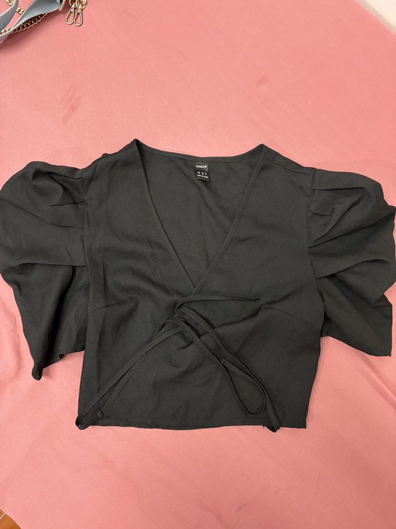 Shein Black Wrap Top (Category: Blouses) located in Manila. Submitted by closetsofaddie (Listing ID 1436585741, Image 1). Description: - Shein black wrap top - Size: M - Features a flattering V-neck - Stylish tie closure - Short, puffy sleeves 💳Mode of Payment: 💙 GCash 🧡 MariBank 🩵 GoTyme 💸 Cash if Meetup! 🚚Mode of Delivery: JnT Delivery Lalamove if nearby/Same day May do meetups.