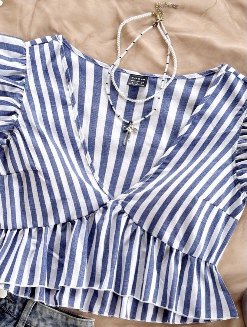 Striped Ruffle Armhole Asymmetrical Peplum Top (Category: Blouses) located in Antipolo. Submitted by scarlet.closet.ph (Listing ID 1436648984, Image 3). Description: ✿ 𝗧𝗢𝗣 𝗗𝗘𝗧𝗔𝗜𝗟𝗦 ✿ PRICE: ₱149 SIZE: L on tag CONDITION: 10/10, no flaws BRAND: S h e i n • cotton ────────────────── ✿ 𝗦𝗛𝗢𝗣 𝗗𝗘𝗧𝗔𝗜𝗟𝗦 ✿ LOCATION: Antipolo City, Rizal COURIER: J&T / Lalamove MOP: BPI / GCash / Maya / GoTyme NOTES: ꕤ all items are already steamed ꕤ pa