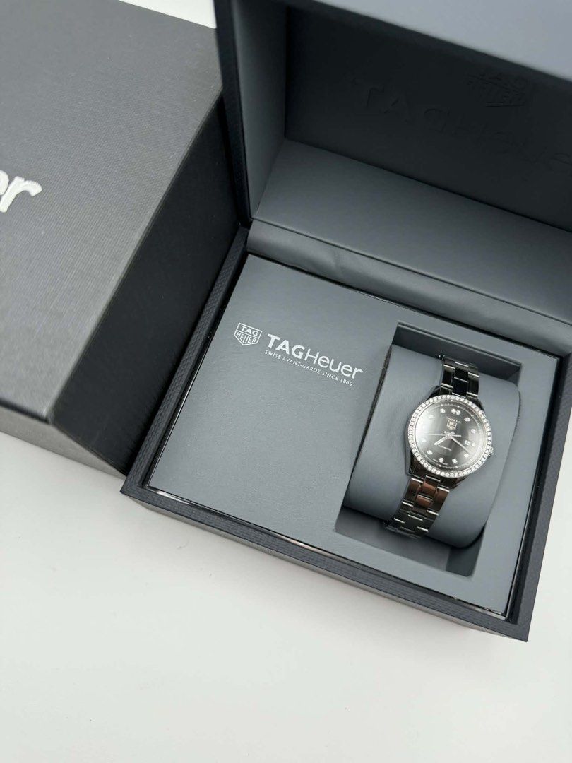 TAG Heuer Carrera Automatic Diamond Watch (Category: Luxury Watches) located in Manila. Submitted by importgoodiesph (Listing ID 1436481288, Image 2). Description: Tag Heuer Carrera Black Dial with Diamonds Automatic Women’s Watch WV2412 - in excellent condition - 67 full cut diamonds (0.608 carat) - 27mm case size - automatic movement - stainless steel bracelet - comes with Tag Heuer box Location: Manila.