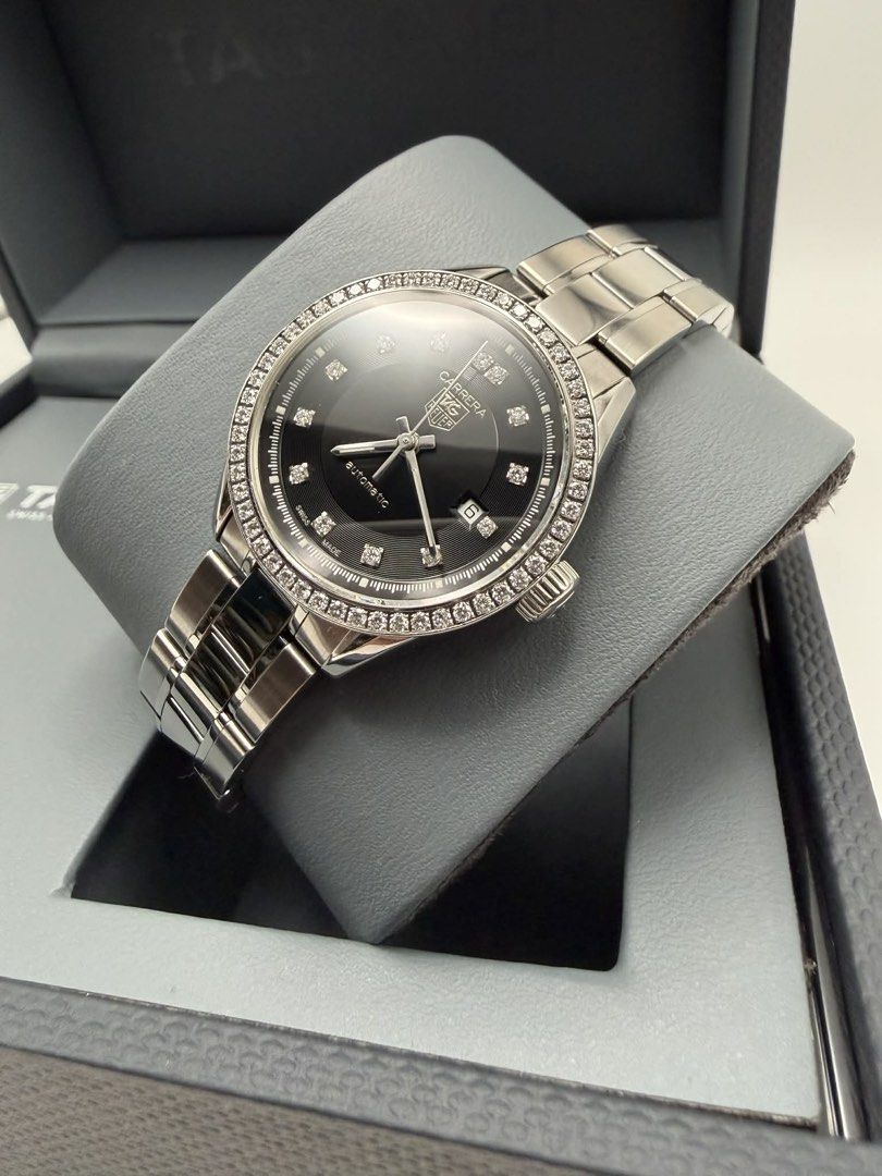 TAG Heuer Carrera Automatic Diamond Watch (Category: Luxury Watches) located in Manila. Submitted by importgoodiesph (Listing ID 1436481288, Image 3). Description: Tag Heuer Carrera Black Dial with Diamonds Automatic Women’s Watch WV2412 - in excellent condition - 67 full cut diamonds (0.608 carat) - 27mm case size - automatic movement - stainless steel bracelet - comes with Tag Heuer box Location: Manila.