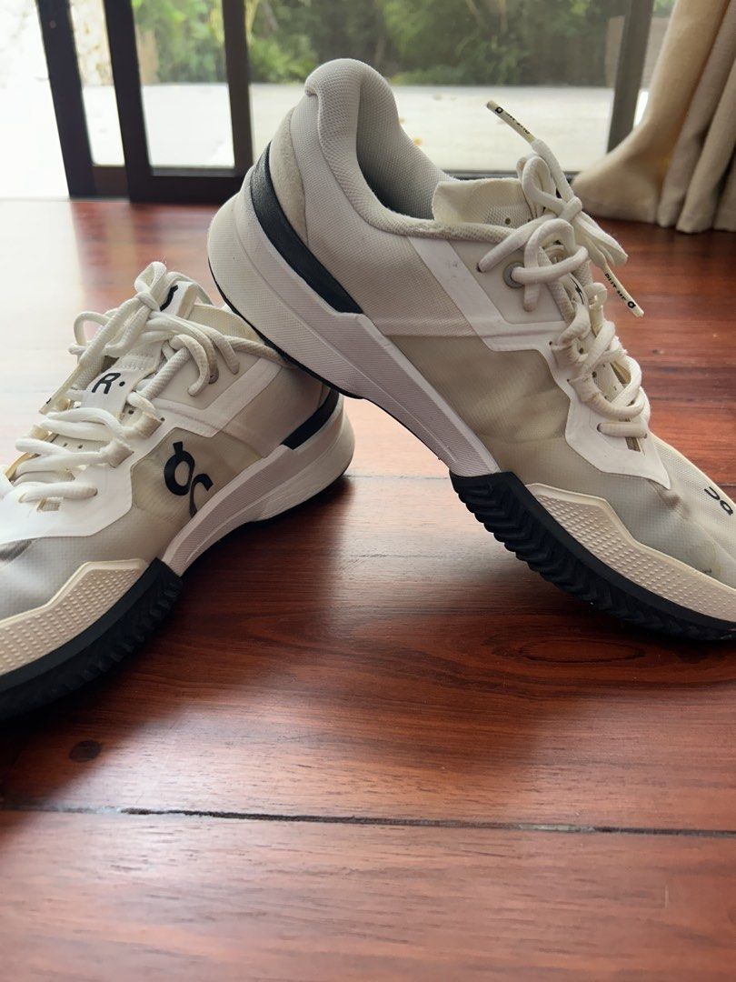 THE ROGER Pro 2 Clay M White | US 10 (Category: Sneakers) located in Cebu City. Submitted by carms123 (Listing ID 1436506559, Image 2). Description: - On Cloudrunner sneakers - Color: White - Features the On logo - Transparent overlay on the front - White laces - Black and white sole - Cushioned sole Flaws shown in picture.