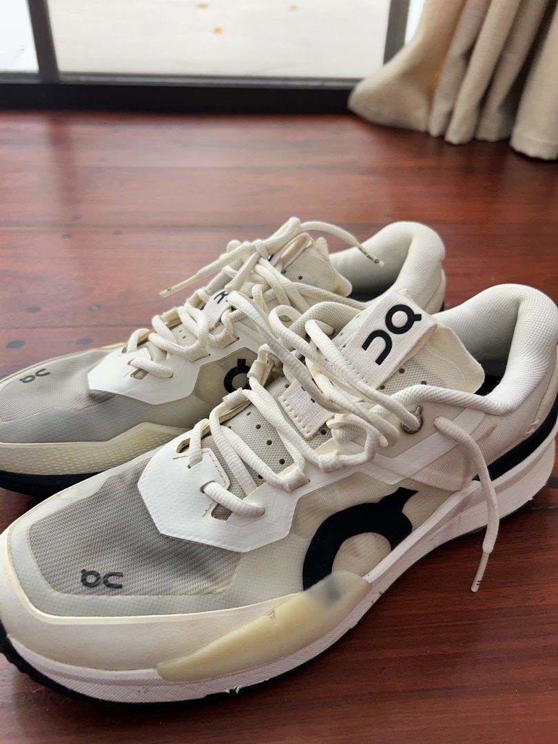 THE ROGER Pro 2 Clay M White | US 10 (Category: Sneakers) located in Cebu City. Submitted by carms123 (Listing ID 1436506559, Image 3). Description: - On Cloudrunner sneakers - Color: White - Features the On logo - Transparent overlay on the front - White laces - Black and white sole - Cushioned sole Flaws shown in picture.
