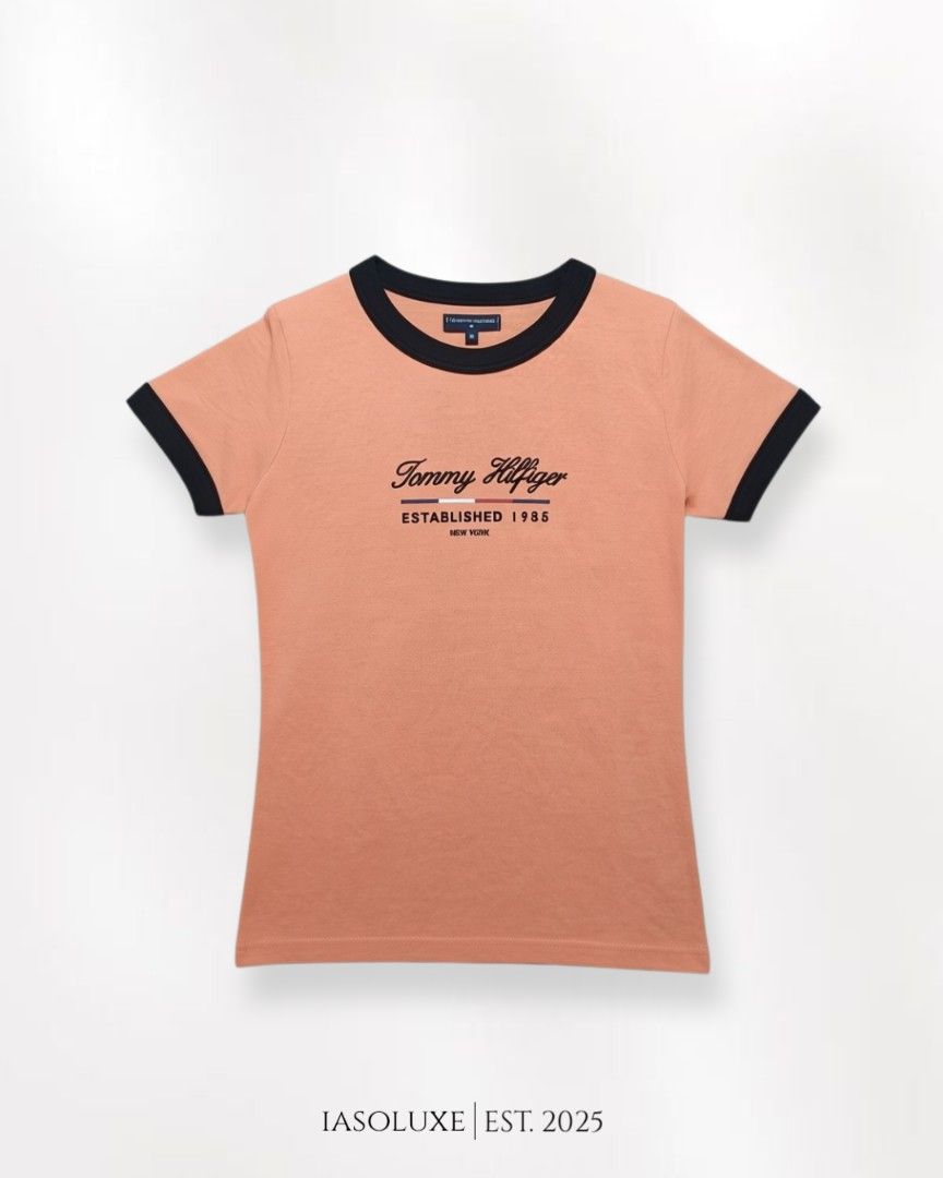 Tommy Hilfiger Peach Ringer T-shirt Medium (Category: Shirts) located in Manila. Submitted by iasoluxe (Listing ID 1436598988, Image 1). Description: Tommy Hilfiger Peach Ringer Women's T-shirt 🎨 Color: Peach 🔖 Size: Medium Dimes: Width: 17.5 in Length: 24.5 in Features: - Cotton fabric - 3D logo graphic - Ringer tee - Fit for the summer Mop: Gcash 📍Location: Manila Courier: Lalamove 🛵: for same time delivery within Manila Jnt 📦: for nationw