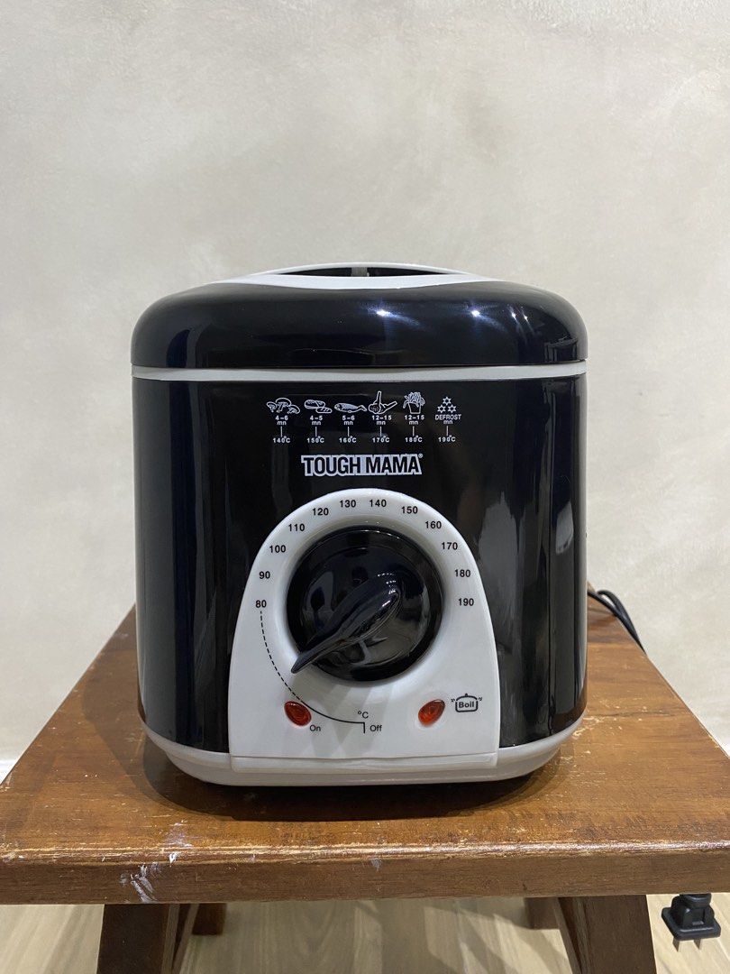 Tough Mama Deep Fryer NTMFRY-1 (Category: Fryers) located in Manila. Submitted by papupeeps (Listing ID 1436617358, Image 2). Description: Tough Mama Deep Fryer NTMFRY-1 with 1-liter capacity bowl. It has power and heat indicators, and a thermostat with a temperature range of 80°C-190°C. The fryer includes a lid with a window for checking the frying process and a removable basket and handle. It also has a non-slip rubber feet for safety..