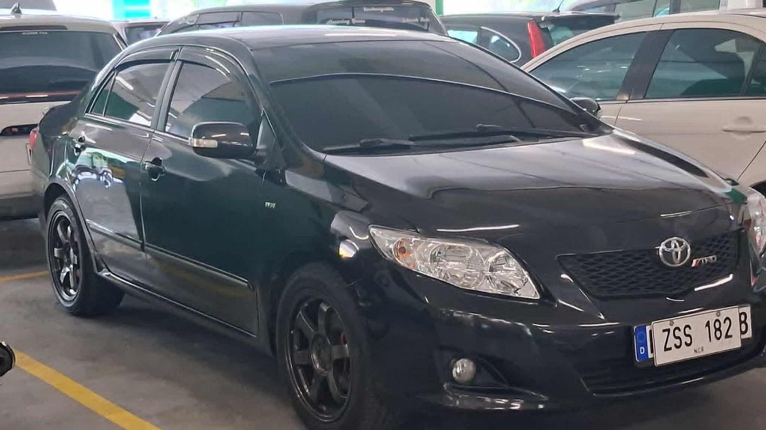 Toyota Corolla Altis 1.6 (A) (Category: Used Cars) located in Pasig City. Submitted by calmdragon (Listing ID 1436492227, Image 2). Description: Toyota Corolla Altis 1.6G 2009 Owner/Seller Midnight Black Shiny Paint Leather Dashboard Leather steering wheel Leather shift knob Reverse Cam Very Good Running condition Very Cold A/C All Lights working Newly reface disk/drum breaks New breakpads orig Toyota New 17s Rota Grid2 mags New Tires 225 50 r17 