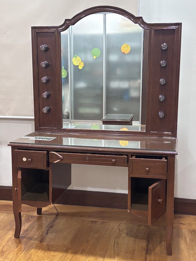 Vintage Vanity Table with Mirror (Category: Tables & Sets) located in Manila. Submitted by supersaleclub (Listing ID 1436649546, Image 1). Description: - Vintage vanity table - solid mahogany wood - Large mirror - Multiple drawers for storage - Classic design - Dark brown finish - Side cabinets with decorative knobs - Glass top - Perfect for bedroom or dressing area.