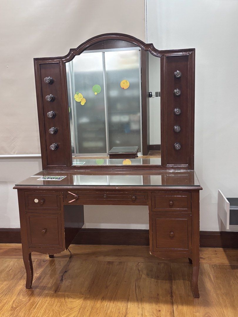 Vintage Vanity Table with Mirror (Category: Tables & Sets) located in Manila. Submitted by supersaleclub (Listing ID 1436649546, Image 2). Description: - Vintage vanity table - solid mahogany wood - Large mirror - Multiple drawers for storage - Classic design - Dark brown finish - Side cabinets with decorative knobs - Glass top - Perfect for bedroom or dressing area.