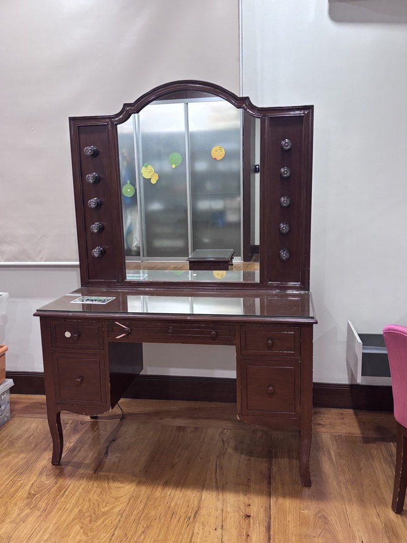 Vintage Vanity Table with Mirror (Category: Tables & Sets) located in Manila. Submitted by supersaleclub (Listing ID 1436649546, Image 3). Description: - Vintage vanity table - solid mahogany wood - Large mirror - Multiple drawers for storage - Classic design - Dark brown finish - Side cabinets with decorative knobs - Glass top - Perfect for bedroom or dressing area.