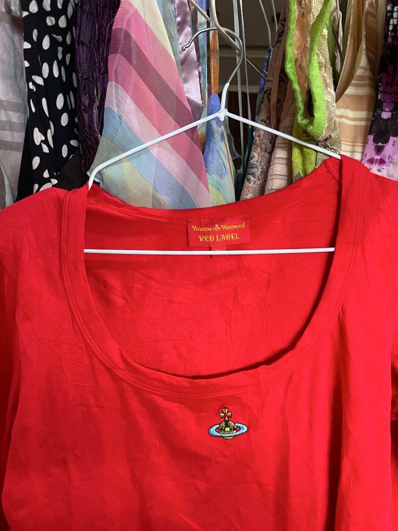 Vivienne Westwood Red Label Top (Category: Sleeveless) located in Iloilo. Submitted by vintagemuseph (Listing ID 1436621089, Image 2). Description: -hearing offers - Authentic Vivienne Westwood Red Label top - Features a classic scoop neck - Stylish three-quarter sleeves - Vibrant red color - Iconic orb logo detail - Made in Italy - Fabric: 92% cotton, 8% elastane.