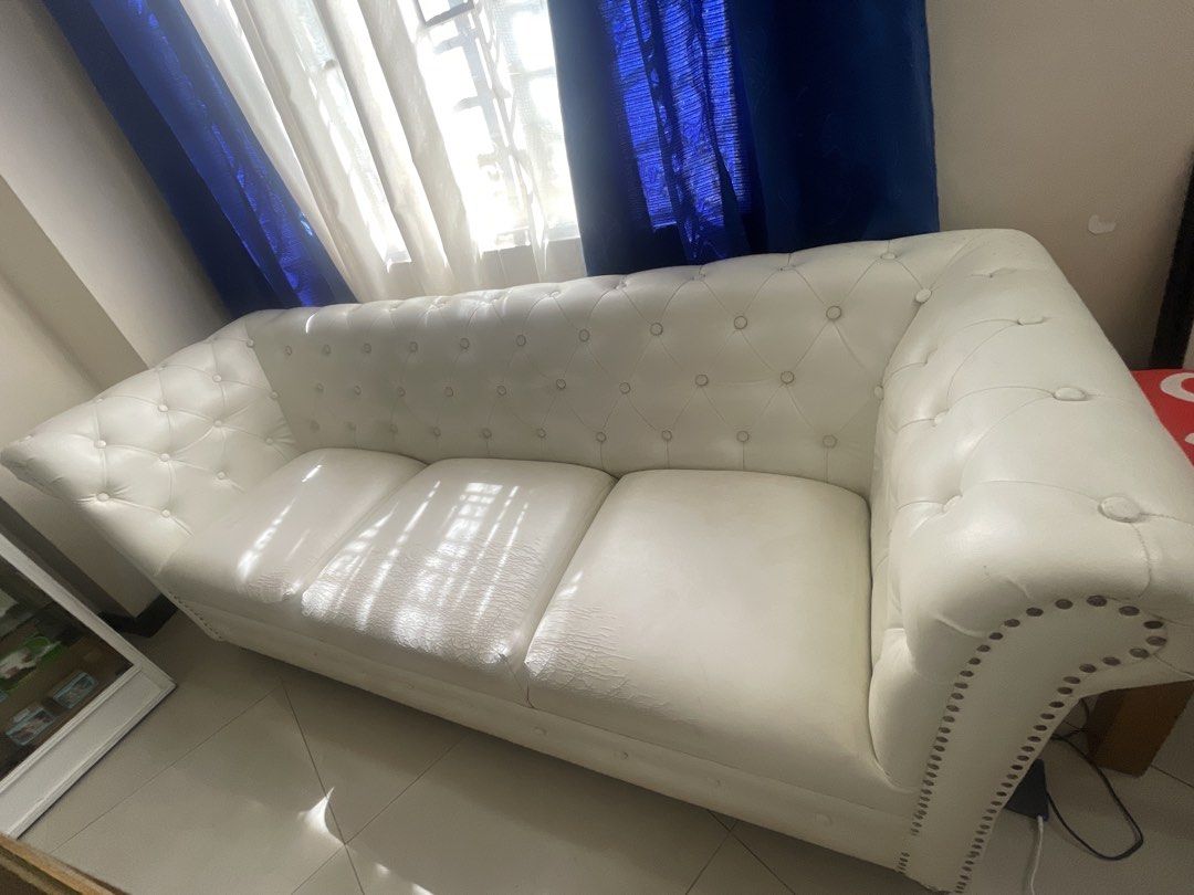 White Leather Sofa (Category: Sofas) located in Rizal. Submitted by annelimited_stuffs (Listing ID 1436521872, Image 2). Description: - White Leather Sofa ✨ Button-tufted design ✨ Elegant and comfortable ⚠️ With visible wear and tear on the cushion Selling at a low price due to condition. 💸 ₱7,000 Message me if interested..