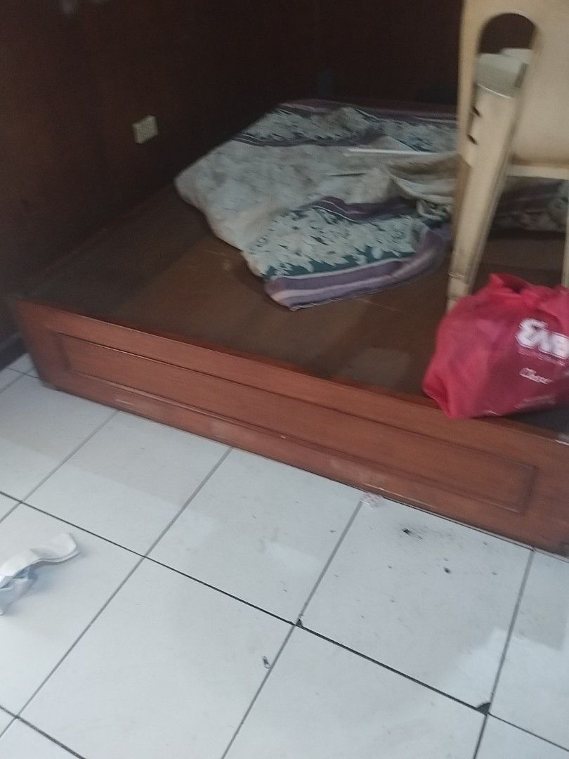 Wooden Bed Frame (Category: Bed Frames & Mattresses) located in Manila. Submitted by deguzmandh17516 (Listing ID 1436507125, Image 1). Description: - Wooden single bed frame - Brown finish - Rectangular shape - Includes headboard and footboard.