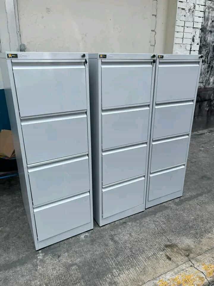 4-Drawer Metal Filing Cabinet (Category: Office Furniture & Fixtures) located in Manila. Submitted by lykcacamacho (Listing ID 1436788635, Image 1). Description: - Durable metal filing cabinet - Four drawers for storage - Available colors: Gray and Black - Each drawer has a handle - Includes a lock for security - Great for organizing documents and files CASH ON DELIVERY VIA LALAMOVE 09664010899 / 09385133266.