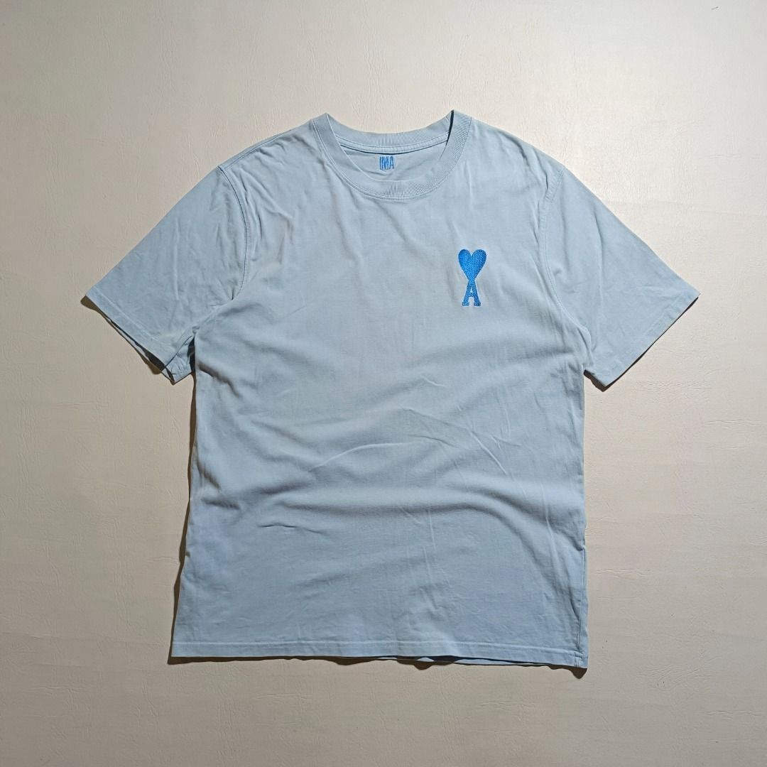 AMI LIGHT BLUE SHIRT (Category: Activewear) located in Baguio. Submitted by freshmarket_2600 (Listing ID 1436671736, Image 1). Description: Brand: Ami Tags: washtag and shoulder size tag only Size: M on tag Dimension: L28W21.5 Condition: Excellent Color rate: 10/10 Color: Blue Issue/s: None.