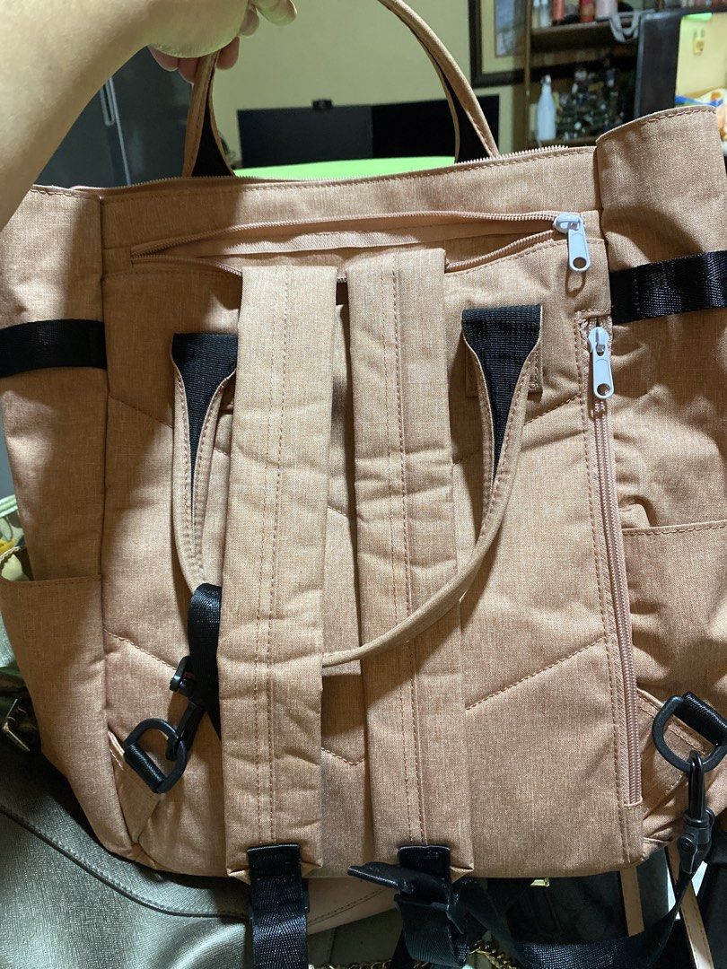 Anello Backpack (Category: Tote Bags) located in Manila. Submitted by sophysells (Listing ID 1436755717, Image 3). Description: - Anello tote bag - Muted pink color - Spacious interior with multiple compartments - Adjustable straps - Side pockets - Front pocket with buckles Meet-up: SM Baguio Delivery: J&T or LBC (Buyer will shoulder the delivery fee; price of the delivery is not yet included in the price).