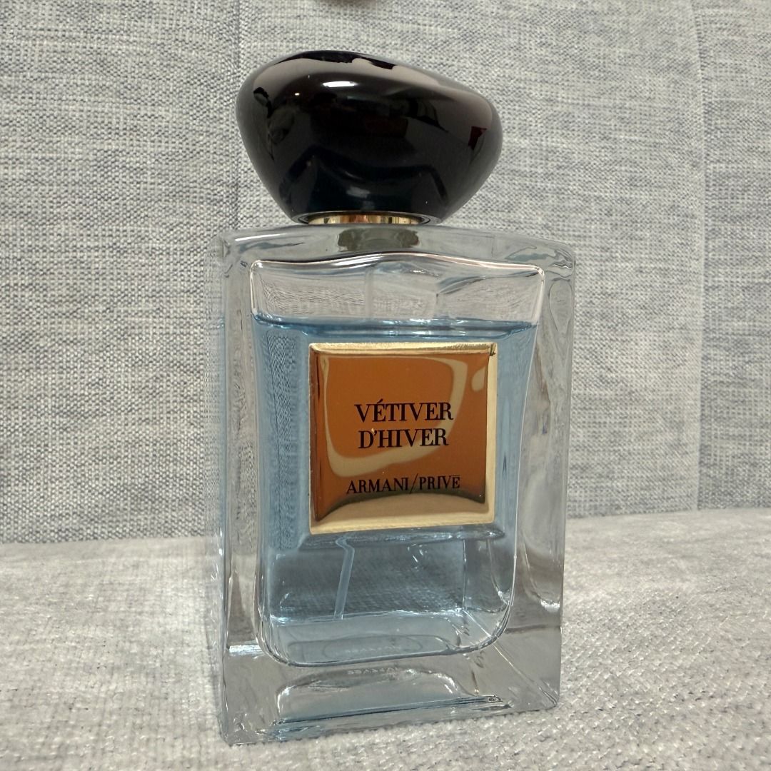 Armani Privé Iris Bleu Eau de Parfum 100ml (Category: Fragrance & Deodorants) located in Makati City. Submitted by kkkkvv (Listing ID 1436820611, Image 1). Description: - Original personal bottle, 100% authentic.No box included. - Approximately 80% remaining, please refer to photos for exact level. - Authentic Armani/Privé Vétiver d'Hiver perfume. - Features a stylish bottle with a dark, rounded cap. - Clear rectangular glass body. - The perfume 