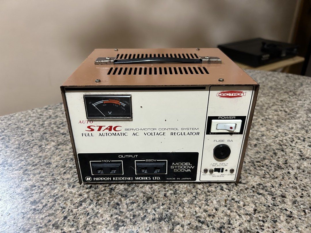 Auto STAC Full Automatic AC Voltage Regulator (Category: Electrical, Adaptors & Sockets) located in Imus. Submitted by drj37ilas (Listing ID 1436771424, Image 1). Description: - Auto STAC Automatic AC Voltage Regulator - Model: ST500W (500VA) - Output: 110V and 220V - Features: Power switch, fuse, line input selector - Made in Japan.