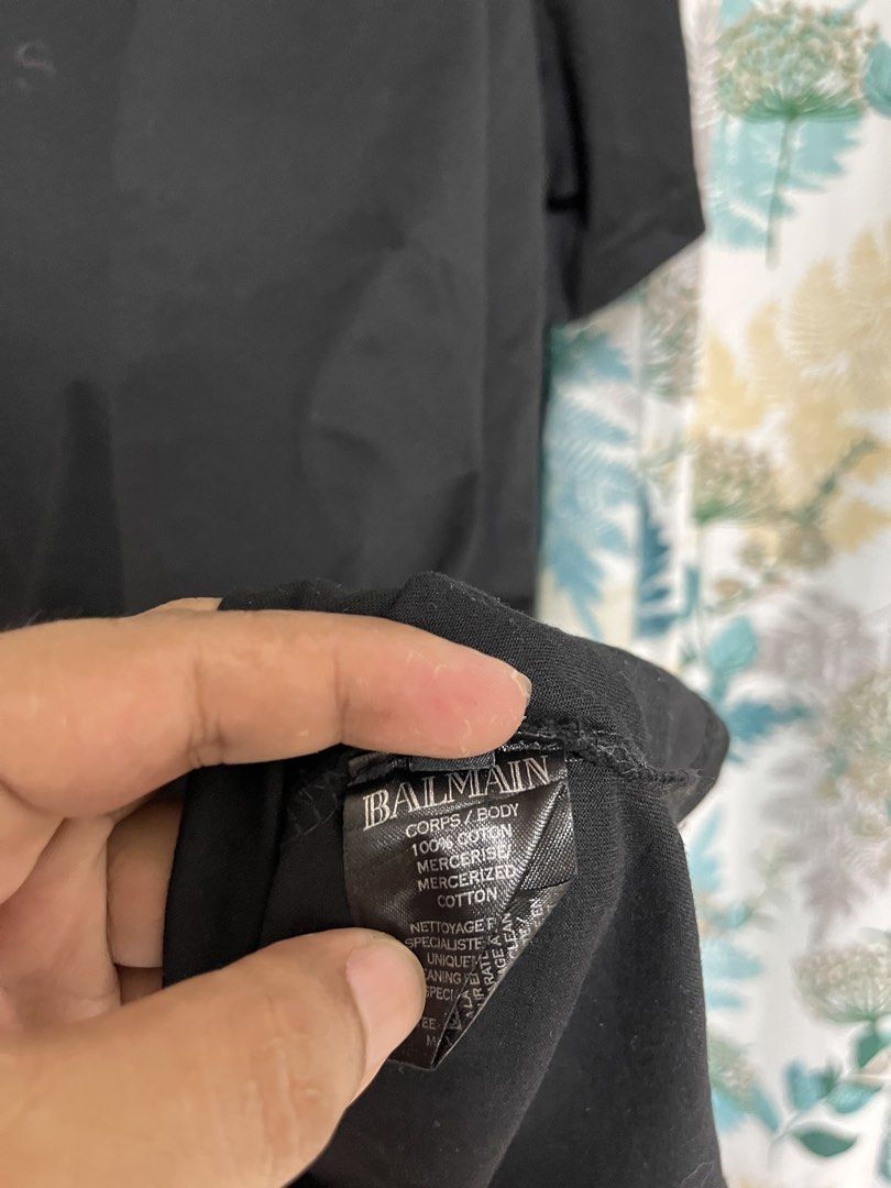 Balmain Paris Black T-shirt (Category: Tshirts & Polo Shirts ) located in General Santos City (Dadiangas). Submitted by crisjayg (Listing ID 1436672804, Image 3). Description: - Balmain Paris T-shirt - Black color - Features the Balmain logo - Made of 100% mercerized cotton - Length: Approximately 29 inches - Chest: Approximately 22 inches - Tag visible in photos.