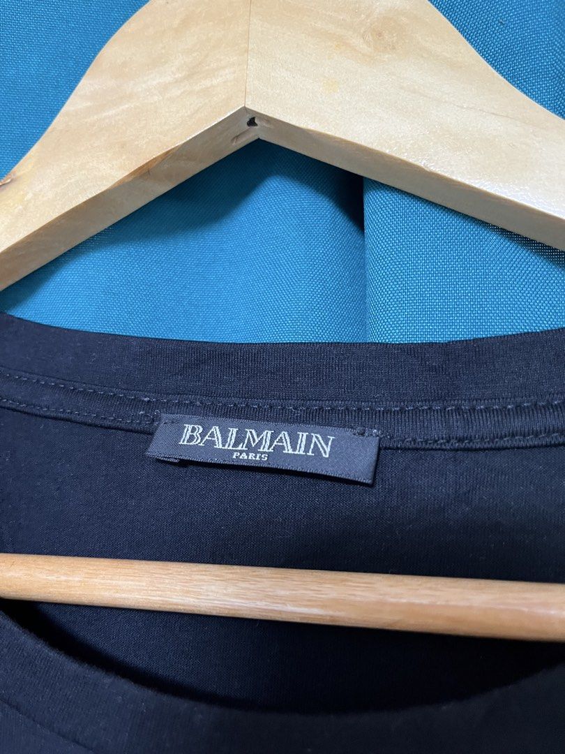Balmain Paris Black T-shirt (Category: Tshirts & Polo Shirts ) located in General Santos City (Dadiangas). Submitted by crisjayg (Listing ID 1436672804, Image 2). Description: - Balmain Paris T-shirt - Black color - Features the Balmain logo - Made of 100% mercerized cotton - Length: Approximately 29 inches - Chest: Approximately 22 inches - Tag visible in photos.