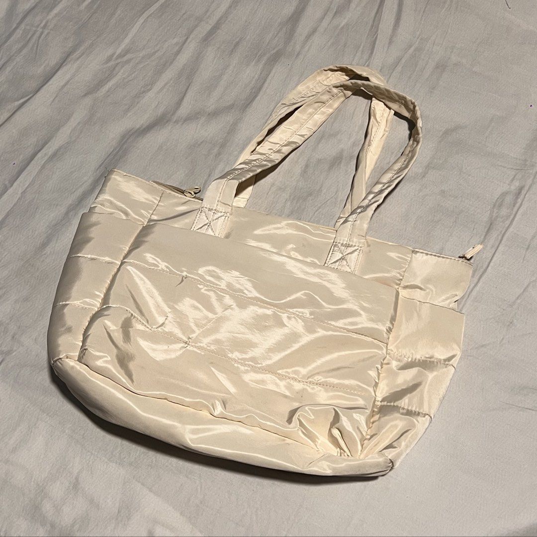 beige cream puffy tote bag (Category: Tote Bags) located in Valenzuela. Submitted by ally.declutter (Listing ID 1436783554, Image 1). Description: very convenient and chic for students :) dimensions posted w the photos last price .