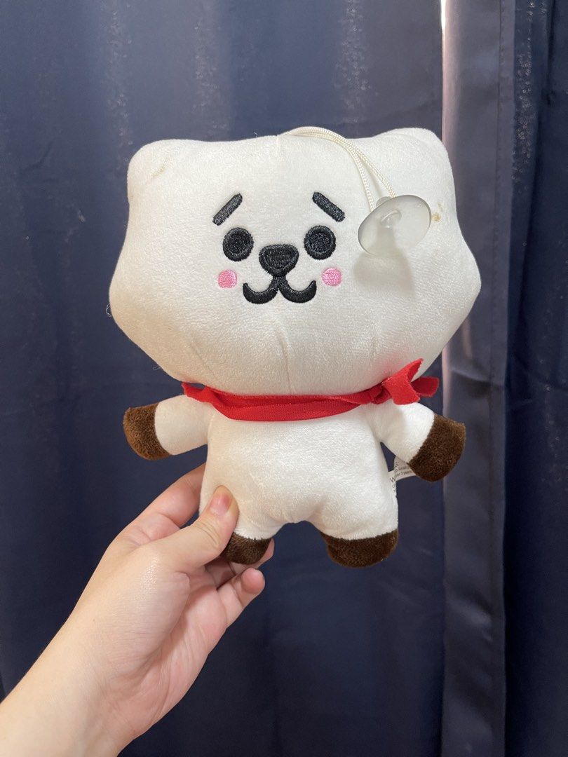 BT21 RJ Plush Toy (Category: Plushies & Soft Toys) located in Taguig. Submitted by supplementary (Listing ID 1436653792, Image 1). Description: - Official RJ BT21 plush toy. - Features RJ's iconic white fur and red scarf. - Includes detailed embroidered features. - Comes with brown paws. - Has a small loop with a suction cup for easy display. - Ideal for BT21 collectors or as a cuddly friend..
