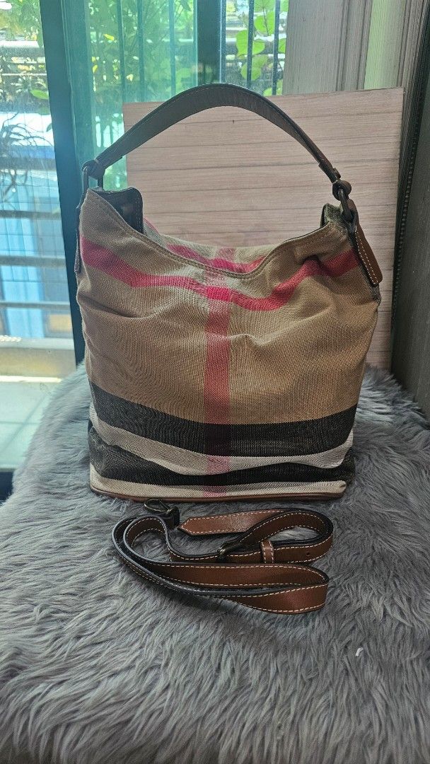 Burberry Hobo Bag with Detachable Strap (Category: Luxury Bags & Wallets) located in Manila. Submitted by everythingnice8888 (Listing ID 1436656577, Image 1). Description: Burberry Ashby Medium Hobo Bag, a signature piece known for its "Mega Check" or "Nova Check" canvas and leather trim. The Ashby is a versatile bucket-style bag that typically features a single leather handle and a detachable crossbody strap, making it practical for daily use. W