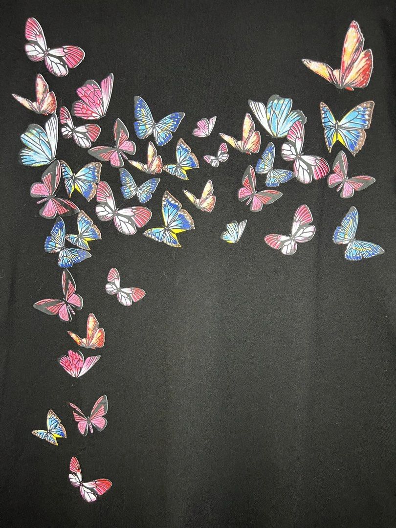 Butterfly Print Black T-shirt (Category: Shirts) located in Quezon City. Submitted by pcera (Listing ID 1436785257, Image 3). Description: - Black t-shirt - Butterfly print (front and back) - Mesh sleeves with ruffle details - Round neckline - 'Fashion' tag.