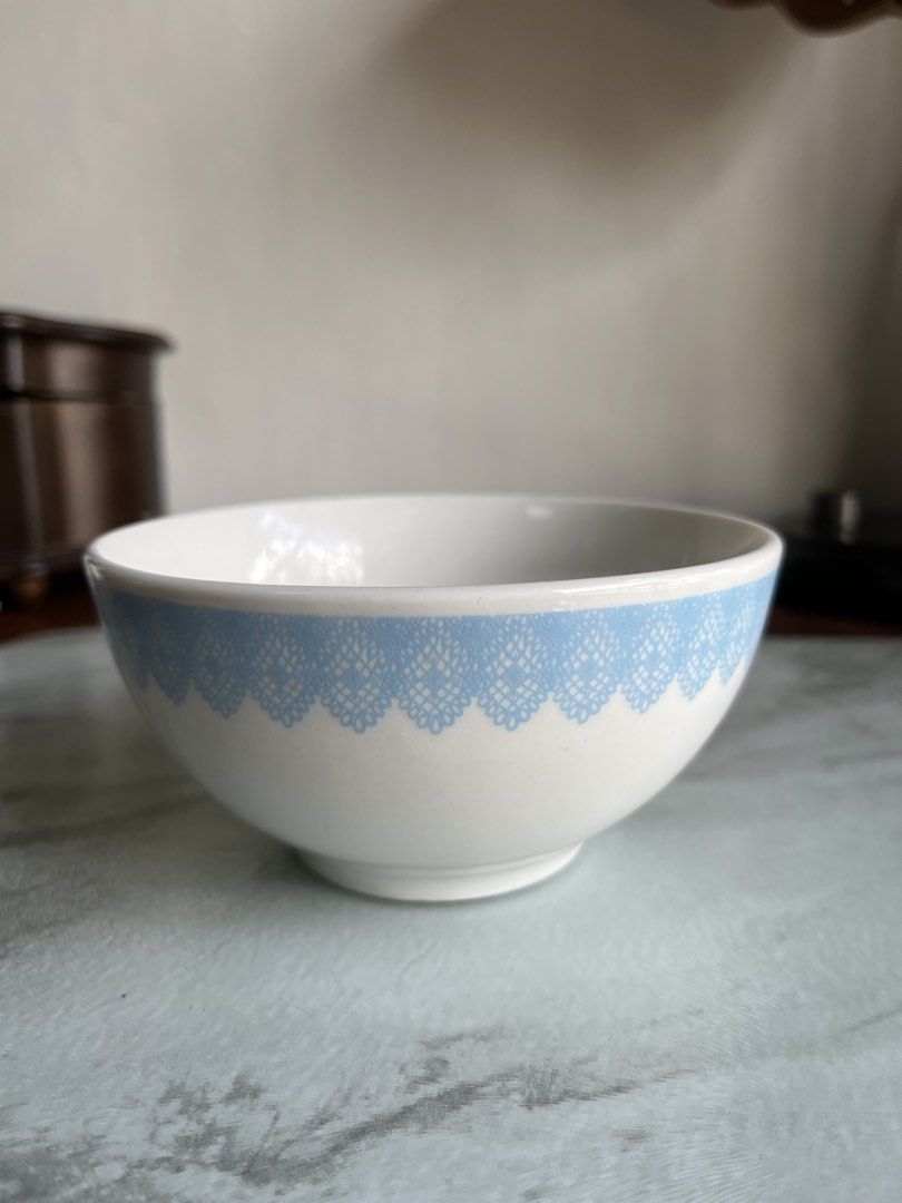 Ceramic Bowl with Blue Lace Design (Category: Dinnerware & Cutlery) located in Taguig. Submitted by minmin_parker (Listing ID 1436767810, Image 1). Description: - Ceramic bowl with a delicate blue lace rim. - Features the word "feminine" inside. - Approximately 5 inches in diameter. - Stands 2.5 inches tall. - Ideal for serving small portions or as a decorative accent..